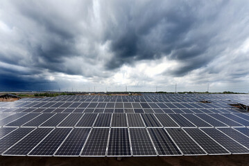 Photovoltaic modules solar power plant on dramatic sunset sky background, Alternative power energy concept to enable sustainable growth and reduce global warming and climate change