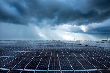 Photovoltaic modules solar power plant on dramatic sunset sky background, Alternative power energy...