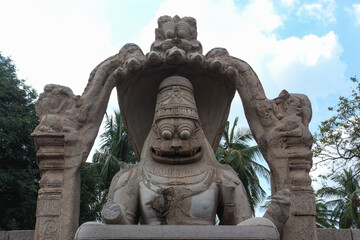 The hypnotising stone carved statute of the Hindu god Vishnu in his Narsimha avatar, that is half lion and half man in Hampi, Karnataka, India.