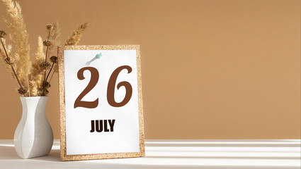 july 26. 26th day of month, calendar date.White vase with dead wood next to cork board with numbers. White-beige background with striped shadow. Concept of day of year, time planner, summer month