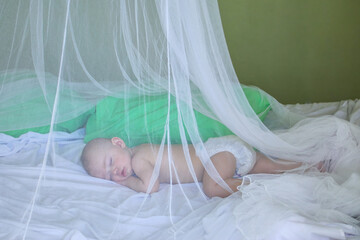 Baby girl sleeping under mosquito net - obrazy, fototapety, plakaty