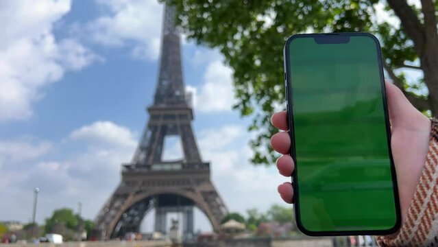The girl hugs the phone presses her cheek against it green screen and chromate in a pink case the girl smiles and shrugs her shoulder. High quality 4k footage