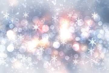Abstract blurred festive light blue pink winter christmas or Happy New Year background with shiny blue and white bokeh lighted snowflakes and stars. Space for your design. Card concept.