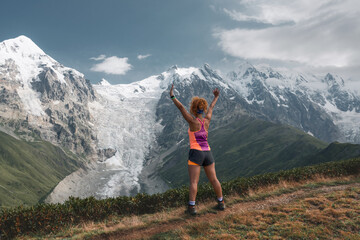 Obraz premium Young active girls hiking in Greater Caucasus mountains, Svaneti region, Mestia district, Svaneti, Georgia