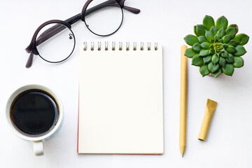 Blank notepad and on office white table