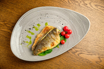 Fried fish fillet with tomatoes