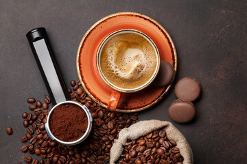 Roasted coffee beans and ground coffee in filter holder
