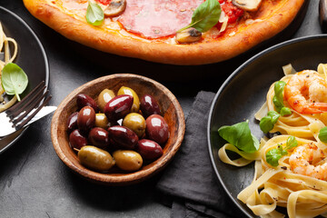 Italian cuisine. Pizza, pasta and olives