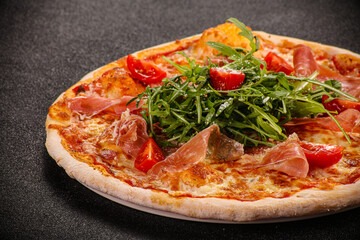 Pizza with parma and rucola