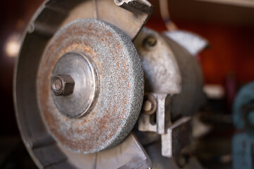 Grinding machine with an abrasive wheel close-up. Grinding wheel