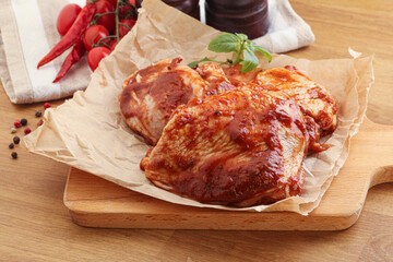 Marinated chicken leg in tomato sauce