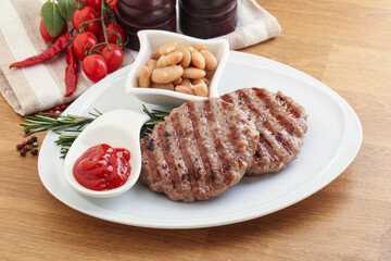 Grilled beef burger cutlet with sauce