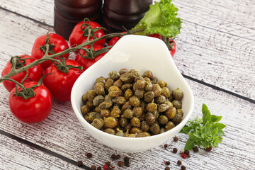 Marinated green capers in the bowl