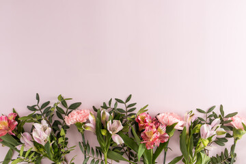 A floral border on a pink background with a copy of the space for your text. postcard, poster. the concept of congratulations.