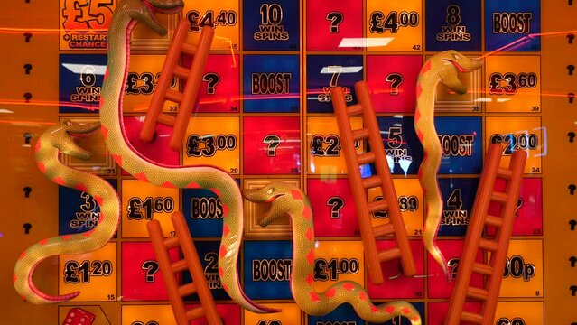 A snakes and ladders machine at an amusement arcade