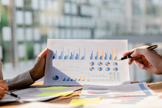 Atmosphere of a startup company meeting, business people are meeting together to summarize and plan investment finances, they are the founders of the company. Business administration concept.