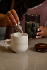 Hands making cup of tea
