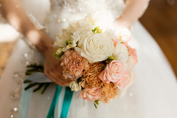 Wedding bouquet of flowers in brides' hands