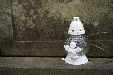 Sanctuary lamps on the headstone at old Cemetery, lampada memory of those who are no longer with us