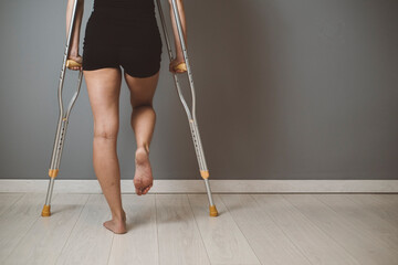 Woman using crutches