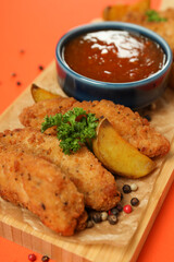 Concept of tasty food with chicken strips, close up