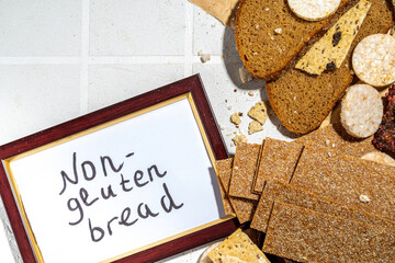 Gluten free allergic diet, celiac disease concept. Collection of various non-gluten different bread, whole grain loaves. Healthy alternative to bread, flatlay copy space