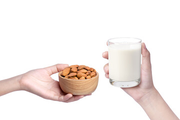 Closeup hands holding bowl with almond nut and glass of milk isolated on white background.