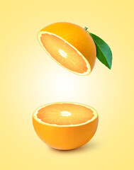 Fresh orange fruit with slice and green leaf isolated on orange color background. 