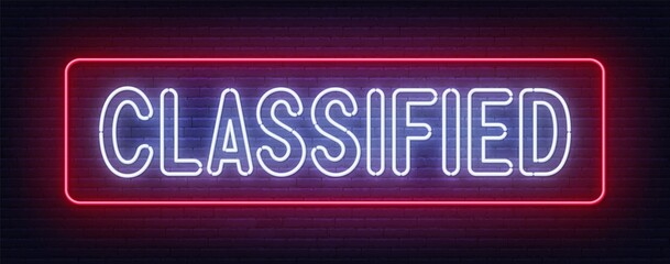 Classified neon sign on brick wall background