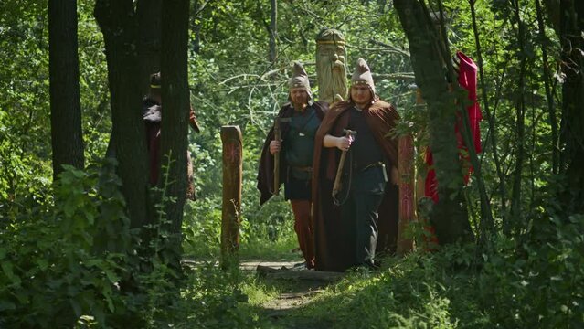 mystical fraternal rite on the blood of two warriors. the priestess and the shaman supervise the execution process.