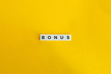 Bonus Word on Letter Tiles on Yellow Background. Minimal Aesthetics.