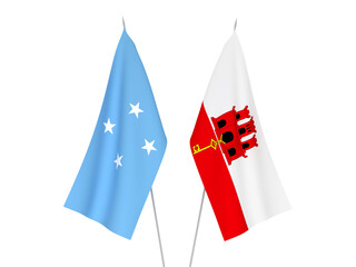 Obraz premium National fabric flags of Gibraltar and Federated States of Micronesia isolated on white background. 3d rendering illustration.