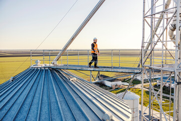 A worker walking on top of the silo. © Dusan Petkovic