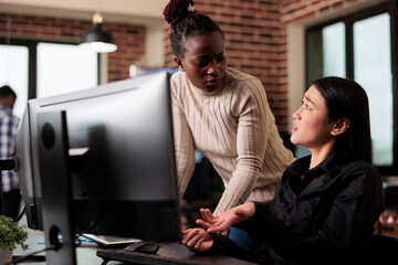 Worried cyber security team members thinking of methods to update defence system without turning it off. Software engineers developing cloud storage network and intelligent algorithm.