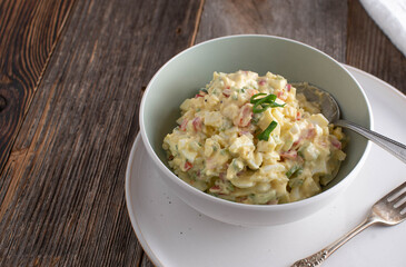 Fitness meal with a low fat egg salad with herbs and vegetables in a bowl