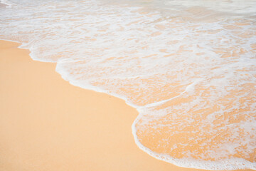 Fototapeta na wymiar Close up. Waves texture lapping across untouched shoreline.