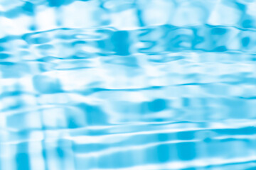 Obraz premium Blurred blue clear water surface texture with splashes. trendy abstract nature background