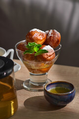 Bowl of Lokma Turkish, loukoumades Greeek with other names in other languages, pastries deep fried dough, soaked in syrup or honey