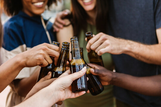 Multiracial Young Friends Cheering With Beer At Summer Music Party