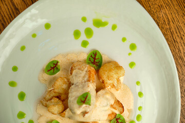 Chicken breast fillet with white sauce and olive oil
