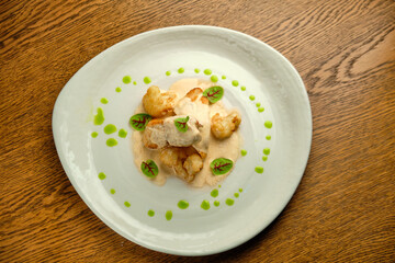 Chicken breast fillet with white sauce and olive oil