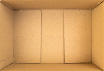 Open empty brown cardboard box background top view