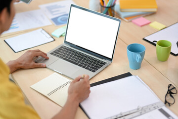 Fototapeta na wymiar Close-up image, Businessman working at his desk, using laptop
