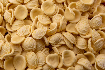Orecchiette, Italian pasta from Puglia made with durum wheat flour and water, typical of the Apulian cuisine, close up top view