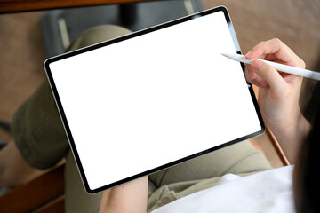 Female designing her graphic adds banner on digital tablet.