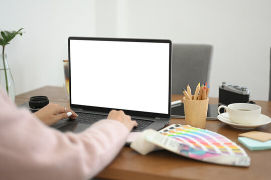 Cropped, close-up, Female graphic designer working on laptop