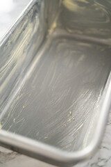 Obraz premium Greasing baking pan