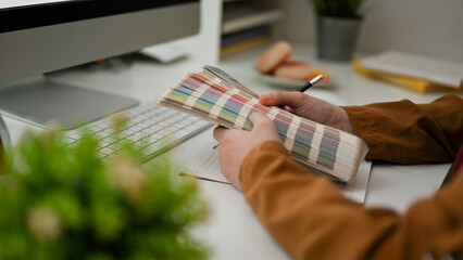 Close-up, A female graphic designer selecting the colour palette