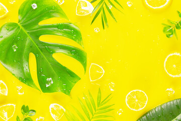 Summer sunny card with tropical leaves, citrus fruits and ice cubes on yellow background with and...