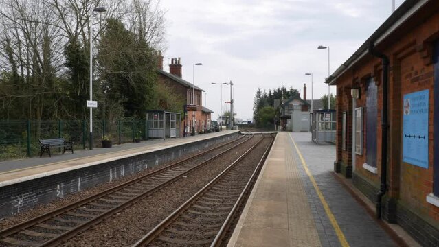 Empty quiet old village railway station in England